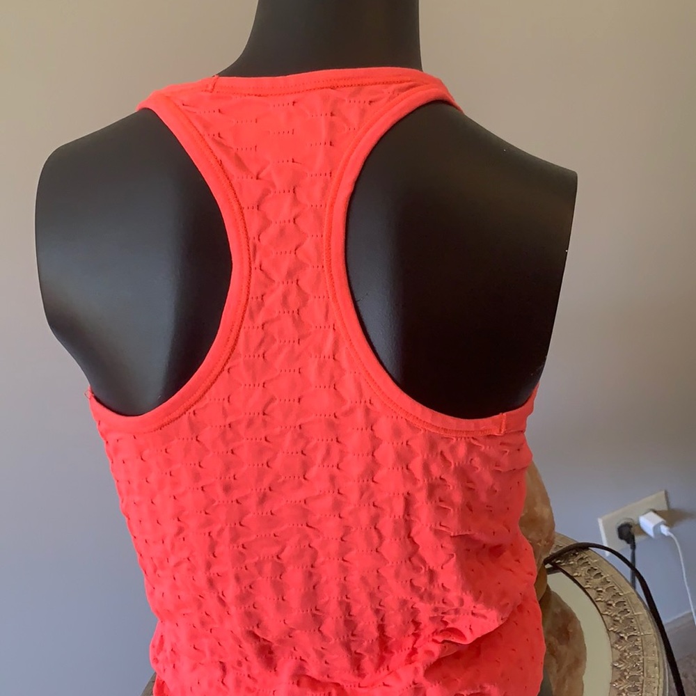 Athleta very sharp bright orange racer back top for working out. Size M